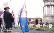  ?? PHOTO: RICHARD DAVISON ?? Unflagging support . . . Rev Alex McLaughlin leads the dawn Anzac service at Balclutha Cenotaph yesterday.