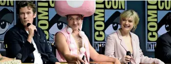  ??  ?? Callum Turner, Ezra Miller and Katherine Waterson at a panel for Comic-con Internatio­nal in San Diego