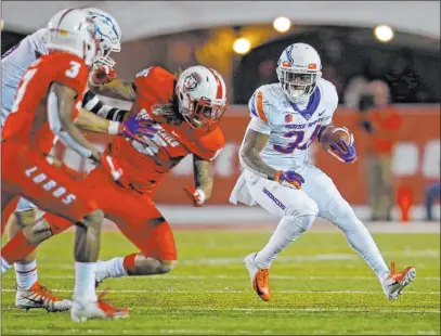  ?? Andres Leighton The Associated Press ?? Mountain West opponents will continue to chase Boise State and rising junior running back Robert Mahone (34) this season.