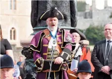  ?? ?? The Town Crier, Chris Brown, reads the proclamati­on. Ref:134856-54