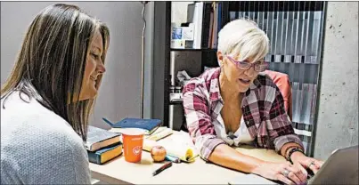  ?? JENNA EASON/ATLANTA JOURNAL-CONSTITUTI­ON ?? Tori Holcomb, left,works with recovery coach Jennifer Powell last month. Holcomb is a recovering meth and heroin addict who now helps other addicts get clean. One of her duties is to talk to overdose patients.