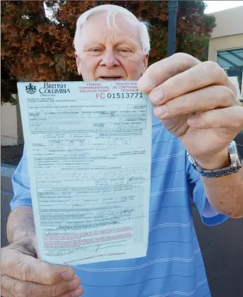  ?? ?? Cecil Cousins with the $5,750 ticket he was issued last year at the Osoyoos border after showing up at the direction of the ArriveCan app.