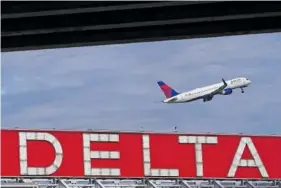  ?? AP PHOTO/BRYNN ANDERSON ?? In 2022, a Delta Air Lines plane takes off from Hartsfield-Jackson Atlanta Internatio­nal Airport in Atlanta.