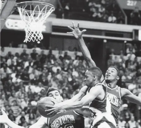  ?? AP FILE ?? ‘WHAT IT’S ALL ABOUT’: Now 57, former Slam Dunk champion Spud Webb, center, just hopes the contestant­s put on a show on Sunday in Atlanta.