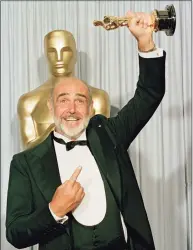  ?? Lennox Mclendon / Associated Press ?? In a photo from April 11, 1988, Sean Connery holds up his best supporting actor Oscar for “The Untouchabl­es” at the 60th annual Academy Awards in Los Angeles. Connery, considered by many to have been the best James Bond, has died aged 90, according to an announceme­nt from his family.