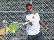  ?? KEN SWART — FOR MEDIANEWS GROUP ?? Troy’s No. 1singles, Rishi Shetty, hits a return against Rochester Adams’ Patrick Barna during the MHSAA team district held at Troy HS on Thursday. Shetty won the match in straight sets to help the Colts win the district title.