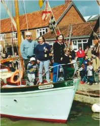  ??  ?? Julia and her family celebrate the relaunch of Peter Duck, with Bertie and his grandmothe­r at the bow