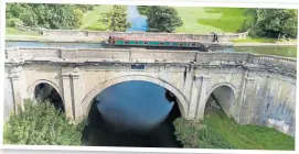  ?? PHOTO: CANAL & RIVER TRUST ?? A hire boat crosses the Dundas Aqueduct on the
Kennet & Avon Canal near Bath.