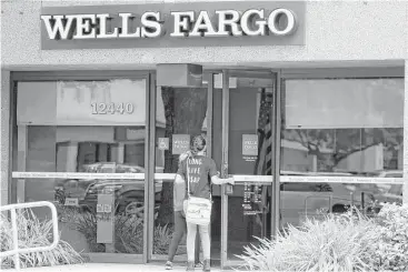  ?? Lynne Sladky / Associated Press ?? Authoritie­s are wondering if employees of Wells Fargo aimed at Latinos, particular­ly those without Social Security numbers or a strong command of English, as they secretly opened unauthoriz­ed accounts.