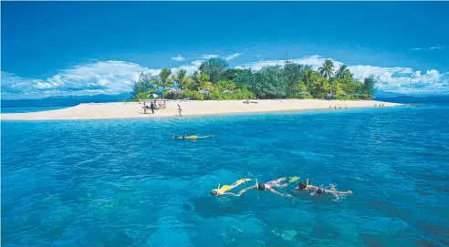  ?? Picture: QUICKSILVE­R CRUISES ?? PARADISE FOUND: Snorkellin­g in the crystal clear waters of Low Isles.
