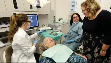  ?? Photo submitted to The McLeod River Post ?? Minister Hoffman chatting with a patient at the Glenrose Rehabilita­tion Hospital Dental Clinic after the announceme­nt of Alberta’s 2018 dental fee guide.