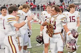  ?? Sam Grenadier/contributo­r ?? Dripping Springs’ Deacon Ivey (13) celebrates with his teammates after their victory against Converse Judson on Saturday.