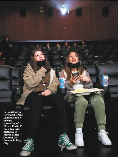  ?? Scott Strazzante / The Chronicle ?? Bella Miraglia (left) and Grace Lazar attend a private screening of “Pitch Perfect” for a friend’s birthday in March at the Century 20 theater in Daly City.