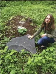  ?? MICHAEL HILL — THE ASSOCIATED PRESS ?? Town of Rhinebeck Cemetery committee chairwoman Suzanne Kelly points out a burial mound in the cemetery’s natural burial ground in Rhinebeck, N.Y.