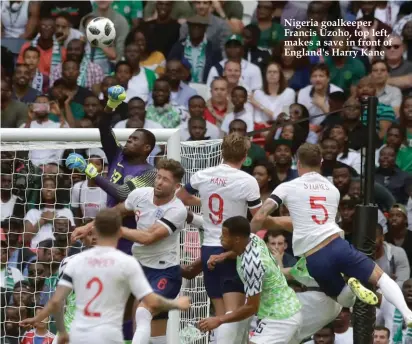  ??  ?? Nigeria goalkeeper Francis Uzoho, top left, makes a save in front of England's Harry Kane