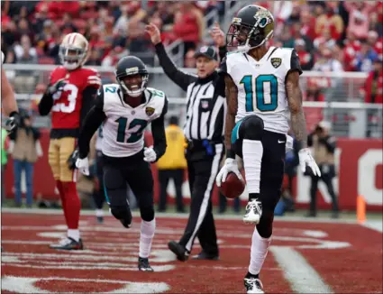  ?? AP Photo/tony AVelAr ?? Jacksonvil­le Jaguars wide receiver Jaelen Strong celebrates after scoring a touchdown against the San Francisco 49ers during the first half of an NFL football game in Santa Clara on Sunday.