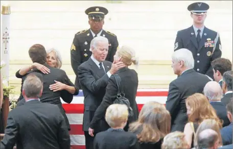  ?? William Bretzger Wilming ton (Del.) News-Journal ?? VICE PRESIDENT Joe Biden greets mourners at the viewing for Beau Biden, who was poised to inherit his father’s status in the family.