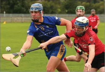  ??  ?? Patrick Fortune of Tara Rocks battles for the ball with Laurence Prendergas­t (Oulart-The Ballagh).