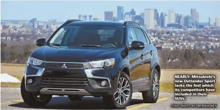  ?? STAFF PHOTO BY JIM MAHONEY ?? NEARLY: Mitsubishi’s new Outlander Sport lacks the feel which its competitor­s have included in their SUVs.