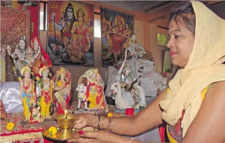  ?? Photo: Ronald Kumar ?? Subhna Prasad offers her Lord Rama prayer at the Sinv Temple in Samabula as Hindu around the world mark the nine days of Ram Naumi prayers on April 13, 2021.