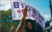  ?? CHANG W. LEE — THE NEW YORK TIMES ?? Protesters hold a banner supporting Joe Biden, the Democratic nominee for president, as they gather near the church where Biden spoke in Kenosha, Wis., on Thursday.