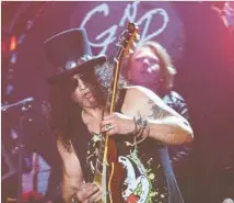  ?? Brian van der Brug Los Angeles Times ?? SLASH and Guns N’ Roses dip into their catalog at Coachella in April. Their loud-and-proud nostalgia trip hits L.A. in August.