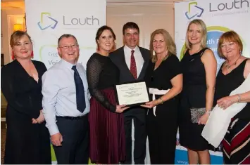  ??  ?? Gerry Murphy Met Éireann presents the members of ALONE (LOUTH) winnersof the Louth PPN Community &amp; Voluntary Awards 2018 in Older People &amp; Disability.