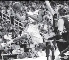  ?? GERRY BROOME / AP ?? North Carolina’s Dexter Strickland passes the ball past Maryland defenders as the Tar Heels won 79-76 Saturday to advance to today’s matchup against Miami in the ACC championsh­ip game.