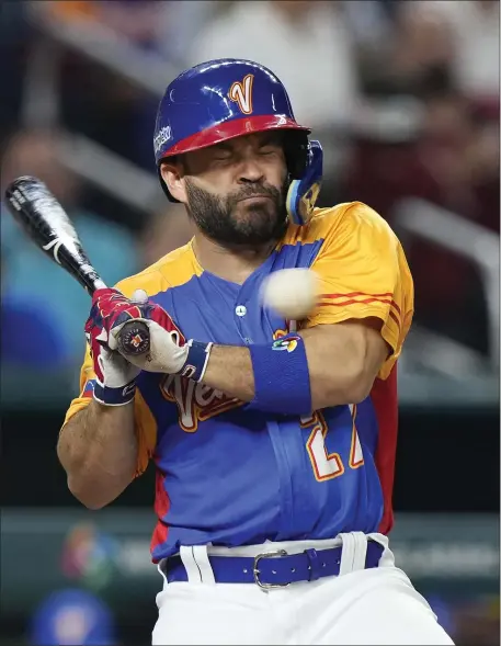  ?? WILFREDO LEE — THE ASSOCIATED PRESS ?? Venezuela’s Jose Altuve is hit by a pitch during the fifth inning of a World Baseball Classic game against the U.S., Saturday, March 18, 2023, in Miami.