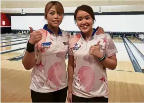  ??  ?? On a roll: Siti Safiyah Amirah Abdul Rahman and Sin Li Jane (right) were in form at the opening rounds of the season-ending PWBA Tour Championsh­ip at the Richmond Internatio­nal Raceway in Virginia.