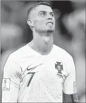  ?? FRANCISCO SECO/AP (RONALDO); ALEXANDER HASSENSTEI­N/GETTY (MESSI) ?? Cristiano Ronaldo, left, is frustrated as Uruguay beats Portugal 2-1. In Kazan, France beat Argentina and Lionel Messi 4-3.