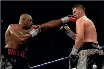  ??  ?? Dillian Whyte punches Joseph Parker during their heavyweigh­t fight at London’s O2 Arena in July. The NZ Medical Associatio­n wants to ban the sport. GETTY IMAGES