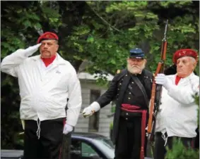  ??  ?? Veterans salute during the Oneida Memorial Day ceremony on Friday, May 26, 2017.