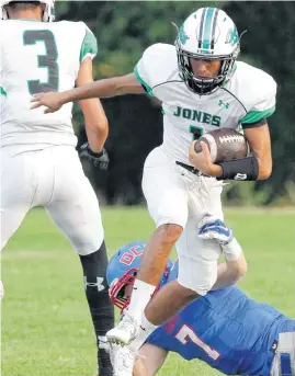  ?? [PHOTO BY DOUG HOKE, THE OKLAHOMAN] ?? Jones’ Dalton May, front, catches a touchdown pass behind OCS’ Caden Levings during a high school football game between Jones and Oklahoma Christian School in Edmond on Friday.