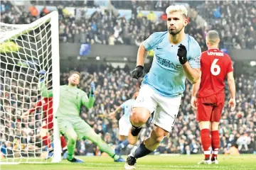  ?? — AFP photo ?? Sergio Aguero blasted Man City into a first-half lead.