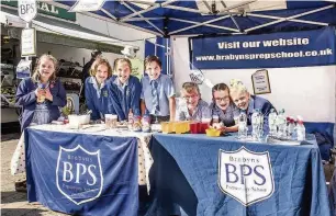  ??  ?? ●●Pupils from Brabyns Preparator­y at the Marple Food and Drink Festival