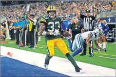  ?? [MICHAEL AINSWORTH/THE ASSOCIATED PRESS] ?? Packers running back Aaron Jones scored four touchdowns last week in Dallas.