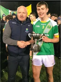  ??  ?? Chairman Pat Dunne presenting the under-15 ‘A’ cup to St. Nicholas captain Rory Martin.