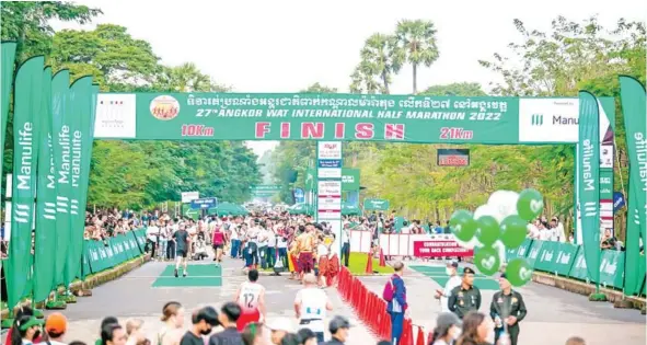  ?? ?? Almost 8,000 runners from 69 countries took part in the 27th Angkor Wat Internatio­nal Half Marathon exclusivel­y sponsored by Manulife Cambodia on December 4.