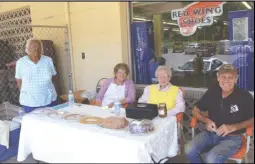  ?? Photo by Jan Clatterbuc­k/rappahanno­ck News ?? From left, Ora Roy, Nina Peyton, Marie Atkins and Phil Drevas from the Rappahanno­ck Senior Center sell baked goods of many kinds at CFC Farm and Home Center's Customer Appreciati­on Day Saturday.