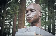  ?? GRAVES/ THE OREGONIAN VIA THE ASSOCIATED PRESS] ?? A bust of York, a member of the Lewis and Clark expedition, is seen Sunday on Mount Tabor in southeast Portland, Ore. The statue appeared the day before. [MARK