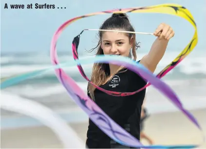  ?? PHOTO: GETTY IMAGES ?? Rhythmic gymnastics athlete Stella Ebert, of New Zealand, performs a routine on the beach at Surfers Paradise yesterday.