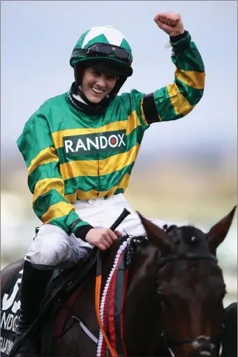  ??  ?? Rachael Blackmore celebrates after winning the Randox Grand National on board Minella Times.