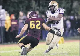  ?? Hans Pennink / Special to the Times union ?? Colonie’s Jarred Rossi, left, goes for a tackle on CBA’S Mike Barber in their game on Friday night. Barber finished with 143 rushing yards.