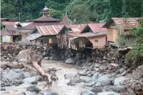  ?? AFP PHOTO ?? SORRY SITUATION
Houses damaged by flash floods and cold lava flow are seen in Tanah Datar district, West Sumatra province, western Indonesia on May 12, 2024.