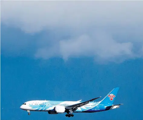  ?? DARRYL DYCK/ THE CANADIAN PRESS ?? A China Southern Airlines Boeing 787 Dreamliner arrives at Vancouver Internatio­nal Airport in Richmond on Feb . 19 .