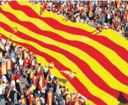  ??  ?? Pro-unity supporters take part in a demonstrat­ion in central Barcelona on Sunday.