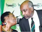  ?? FILE ?? Sports Minister Olvia ‘Babsy’ Grange (left) shares a word with president of the Jamaica Olympic Associatio­n Christophe­r Samuda during a recent sports conference in Kingston.