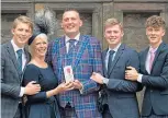  ?? ?? Doddie with wife Kathy and sons Hamish, Ben and Angus, after being honoured by the Queen in 2019