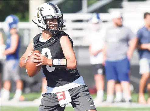  ?? Matthew Brown / Hearst Connecticu­t Media ?? Trumbull quarterbac­k Riley Simpson passes during the 2019 Rip It and Grip It tournament that features 7-on-7 football scrimmages at New Canaan High School.